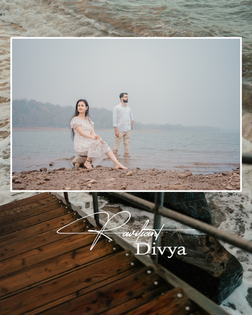 A couple, Ravikant and Divya, posing by a serene lakeside with gentle waves in the background. Divya sits elegantly on a rock, while Ravikant stands nearby, gazing into the distance.